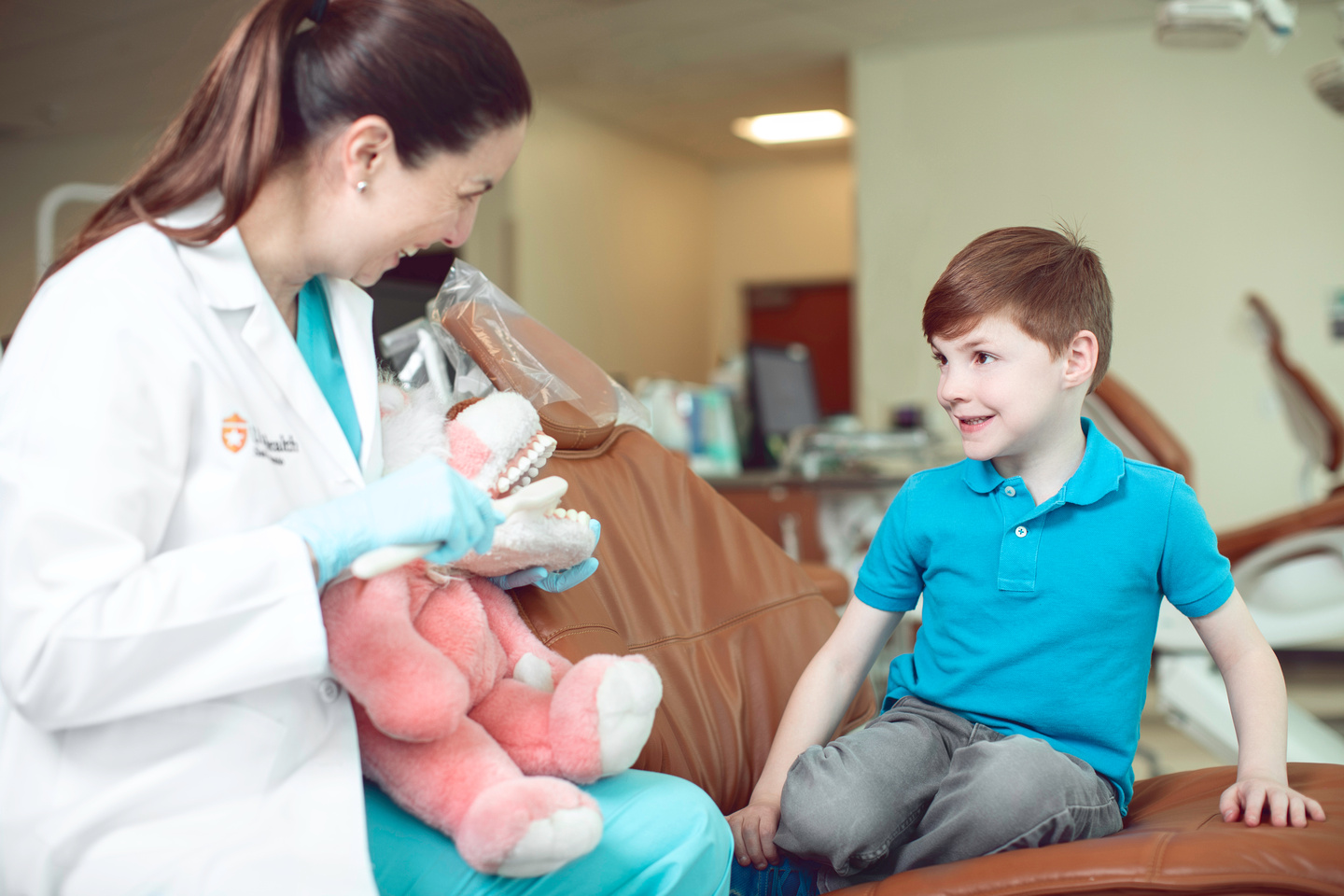 Pediatric dentist with patient