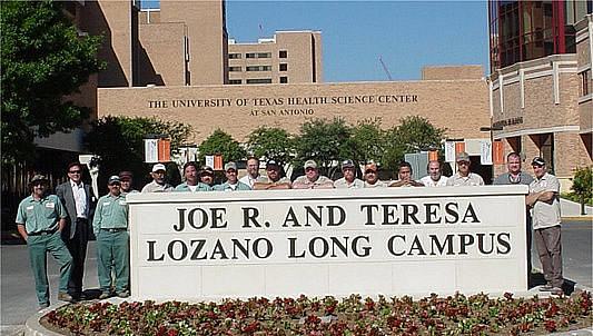 The Men Behind The Sign