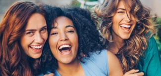 Smiling group of three women