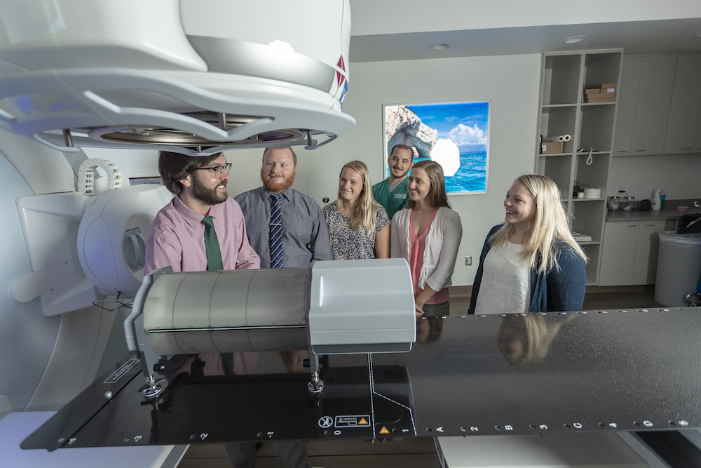 Students being shown an MRI machine
