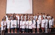 MLS Class of 2024 poses in white coats after ceremony