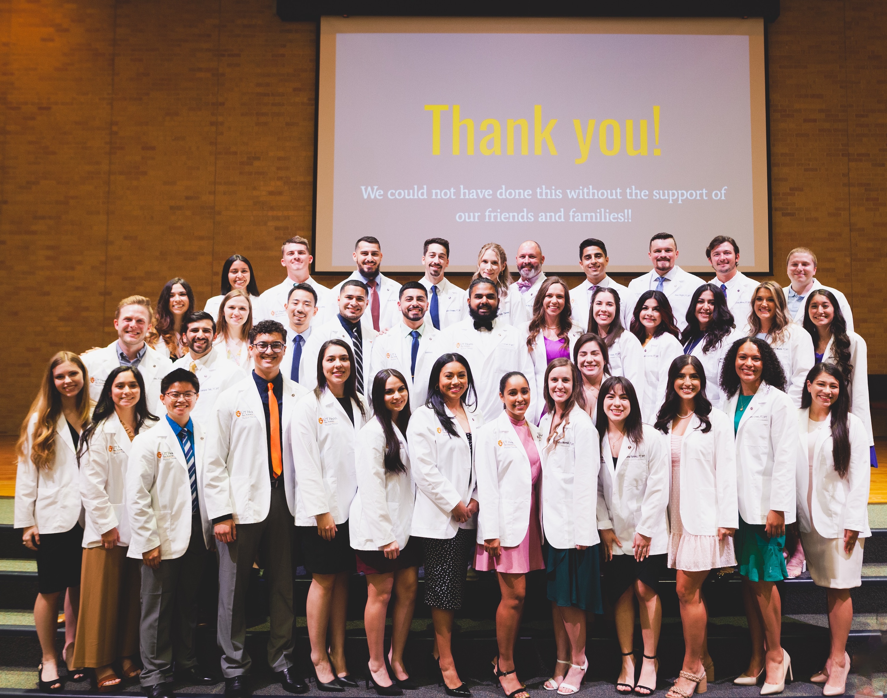 Doctor of Physical Therapy students wear their white coats at ceremony