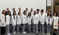 MS in Imaging Sciences students pose with faculty members after receiving their white coats.