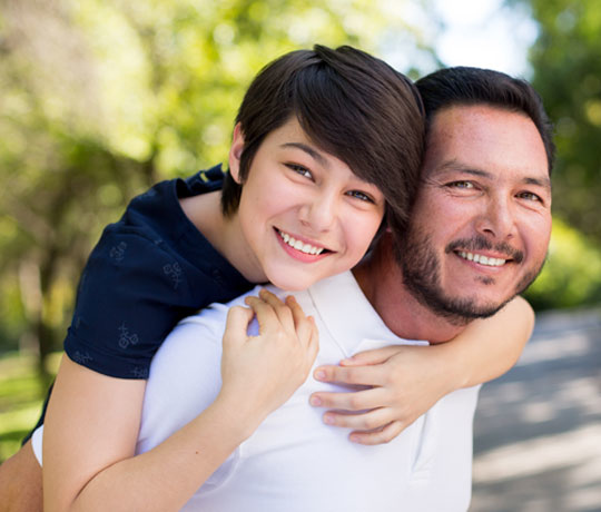 Smiling father and daughter