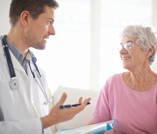 Young doctor with mature patient