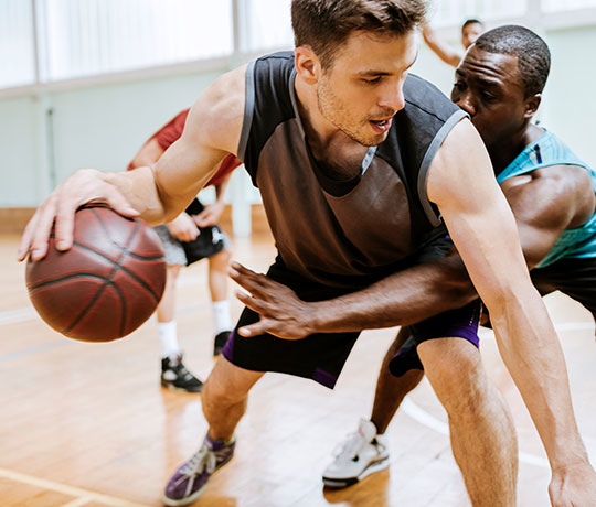 Men playing basketball