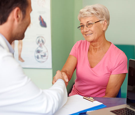 Woman with physical therapist