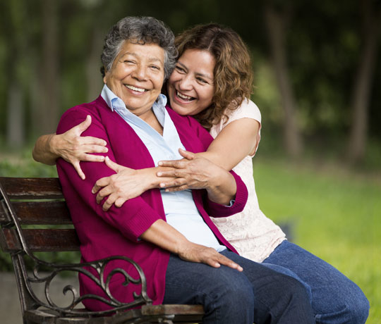 Mother and daughter smiling