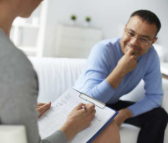 Man speaking with psychiatrist