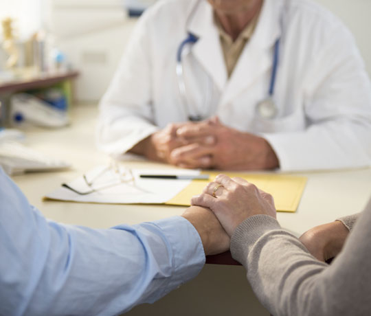 Couple meeting with doctor