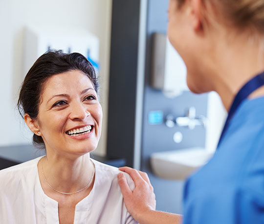 Nurse with female patient