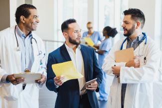 Doctors conferring with each other