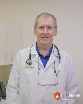 Dr. Sheperd wearing his white coat and smiling
