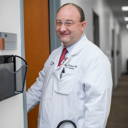 Dr. Anderson opening office door