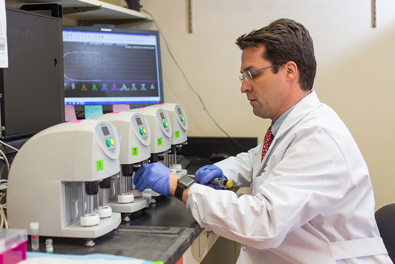 researcher with microscope