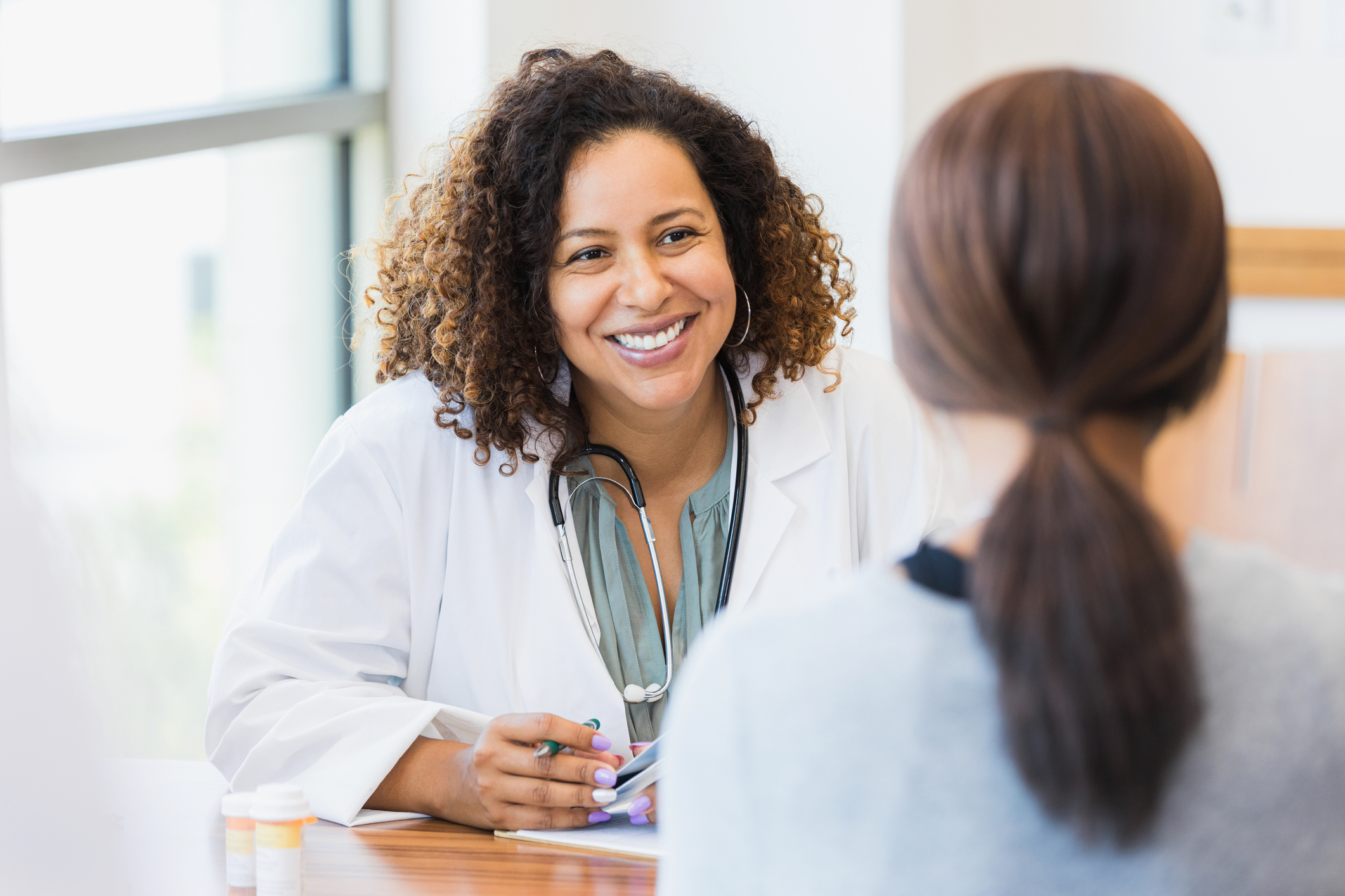 Female doctor smiling at patient