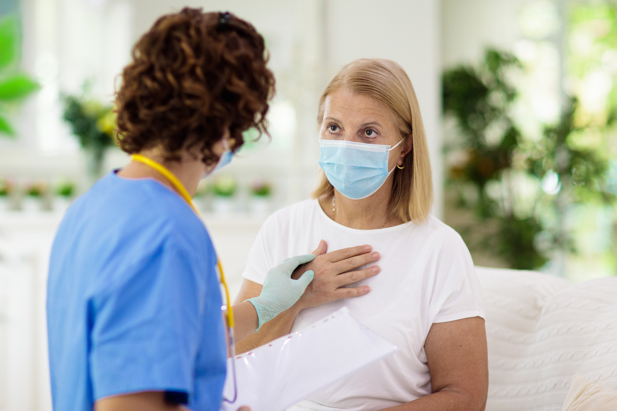 medical professional examining female patient