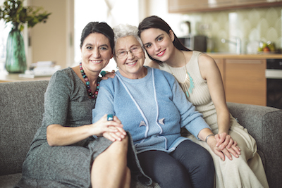mother, daughter and grandmother smiling