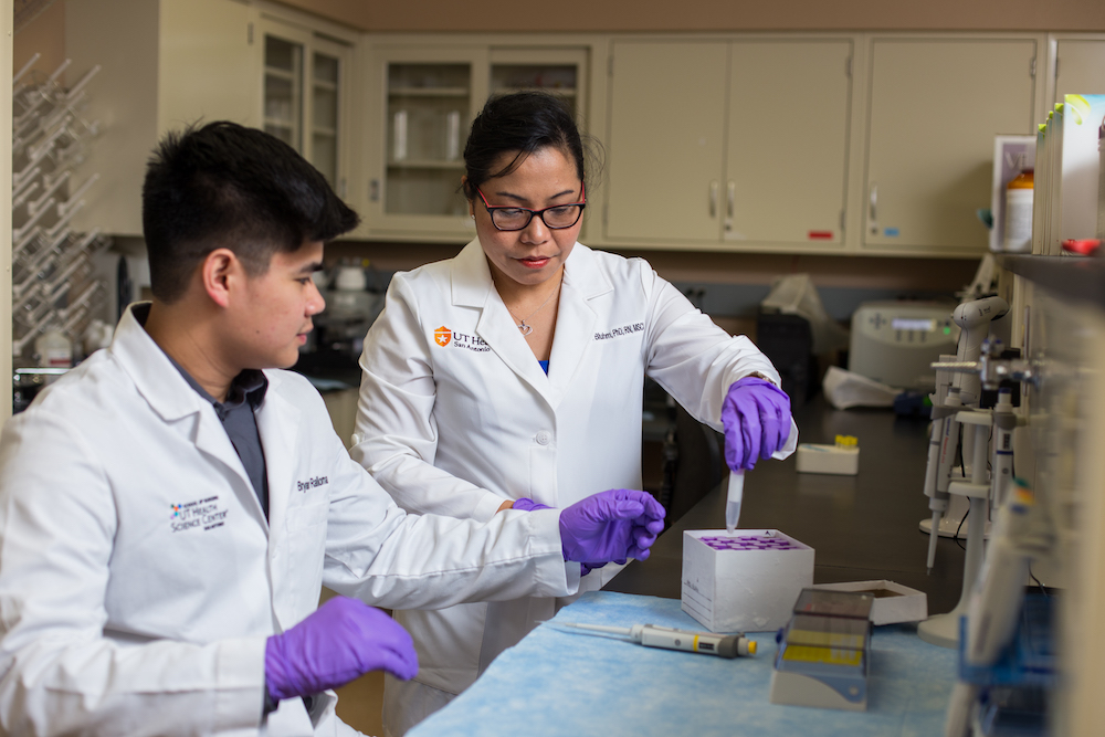 Researcher with student