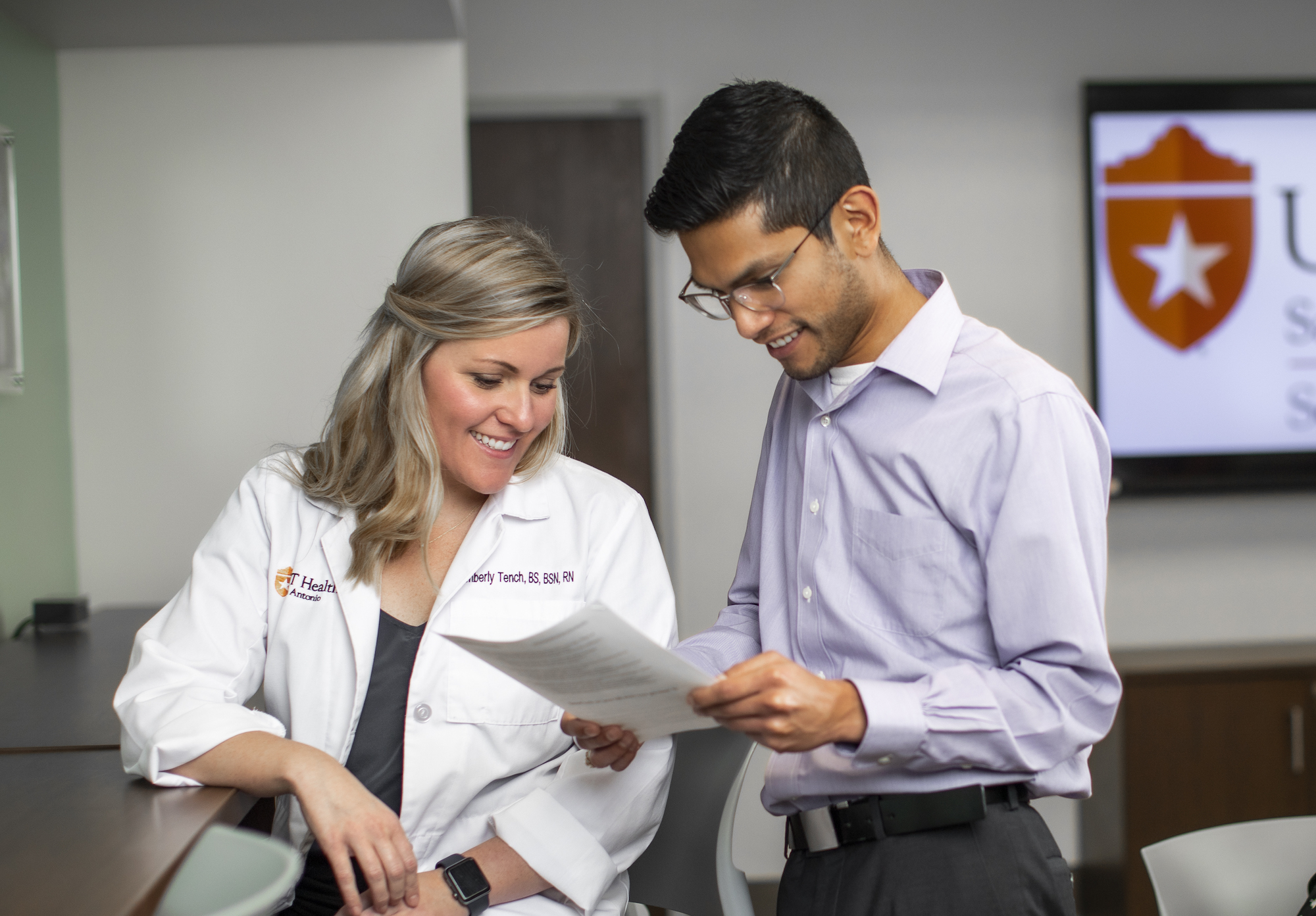 student reviews resume with student success staff member
