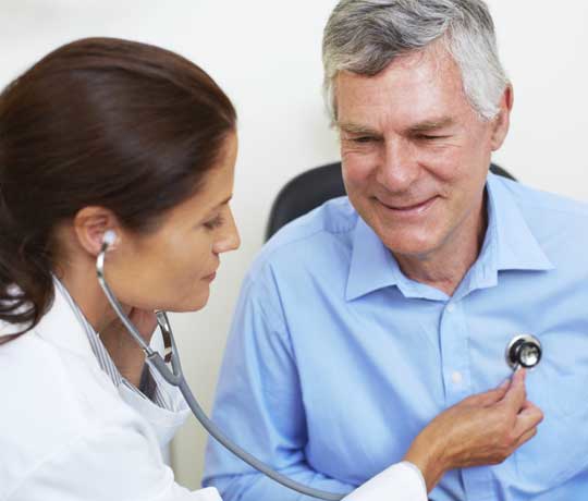 Physician listening to patient's heart