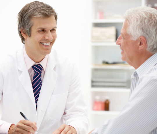 Male doctor with mature patient