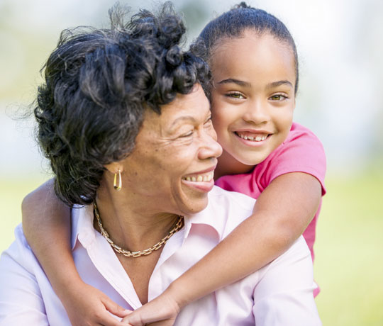 happy grandmother and granddaughter