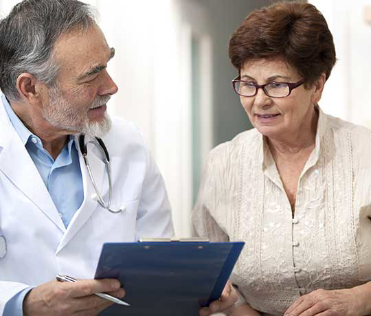 Woman speaking with physician