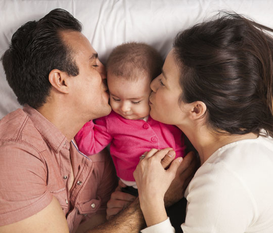 happy parents with baby