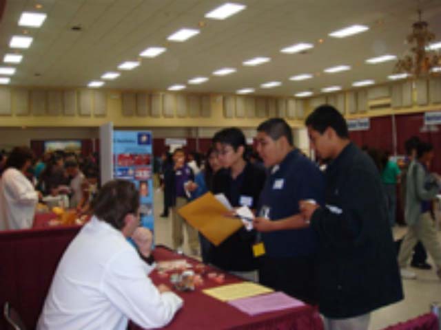Image of students talking to residents