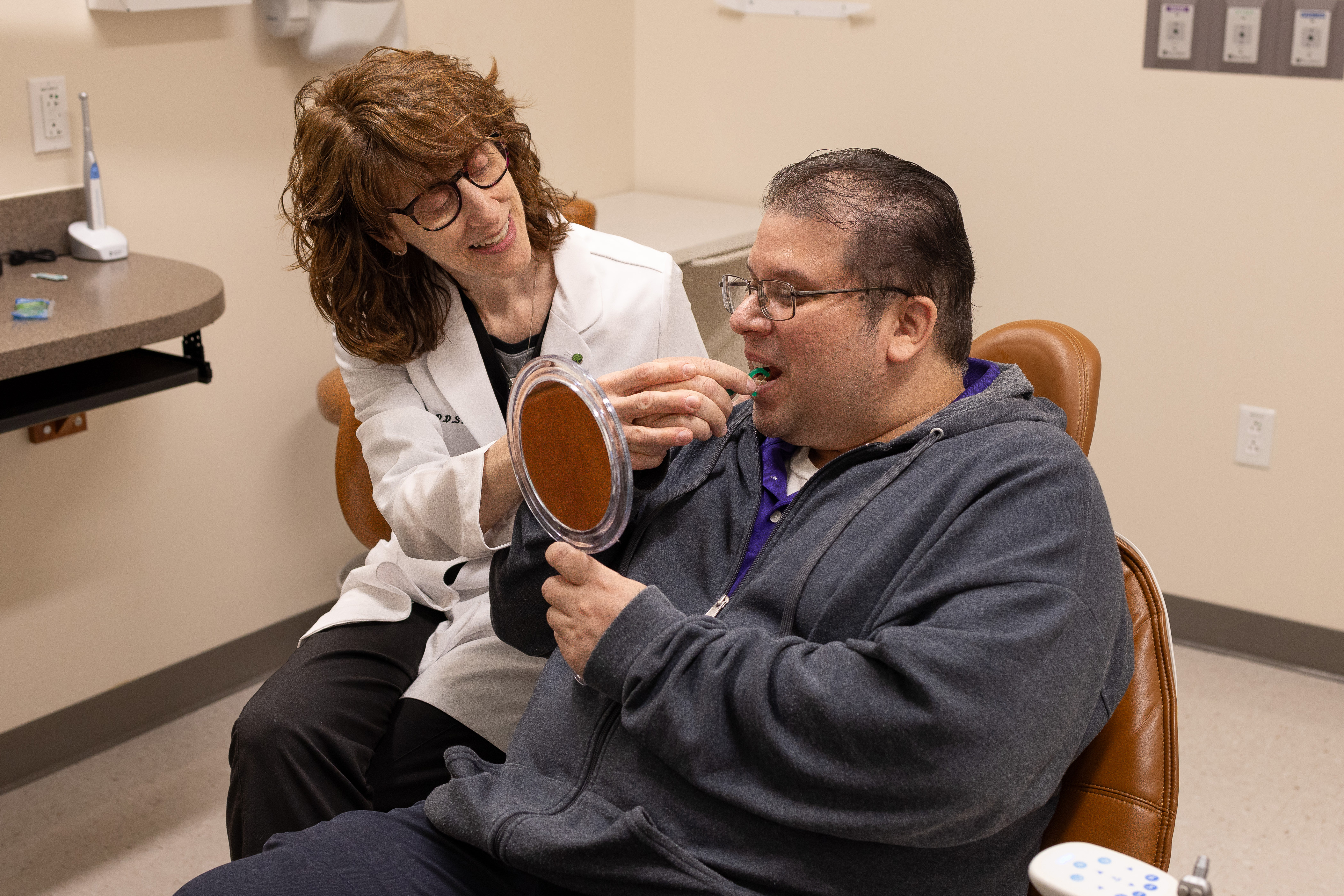 Dr. Farrell with special needs patient in the dental clinic