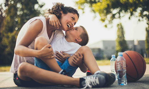 Woman with kid and basketball