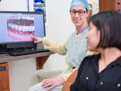 Periodontist reviewing dental x-rays