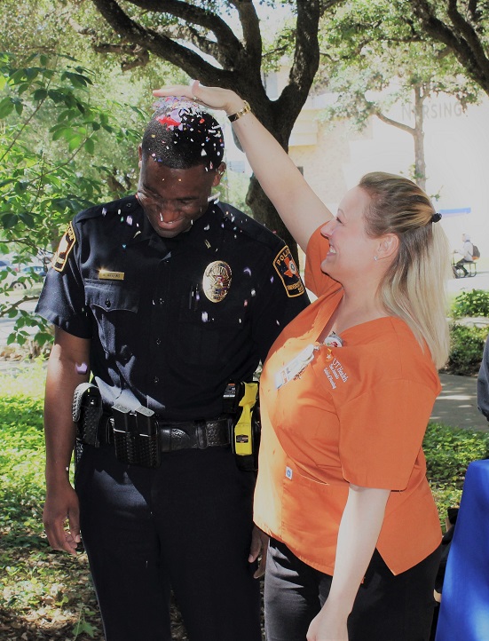 UT Police officer helping a student on campus