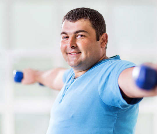 Overweight man exercising