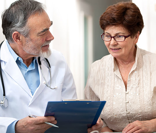 Doctor speaking to patient