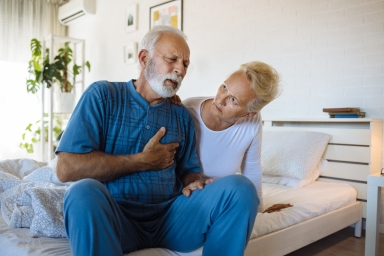 Man sitting with chest pain