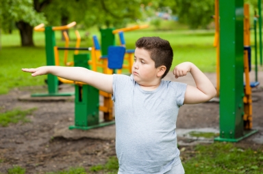 Kid Flexing muscles