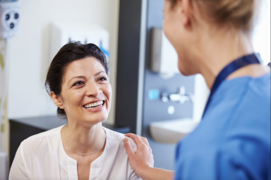 Patient smiling with doctor