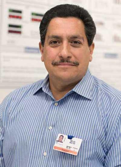 Walter Mejia works with researchers to help keep equipment running smoothly at the South Texas Research Facility