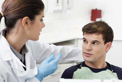 An oral medicine specialist discussing treatment options with a patient