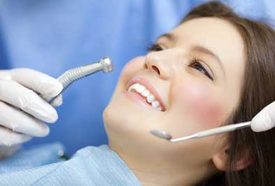 Oral surgeon preparing to perform a biopsy on a dental patient 