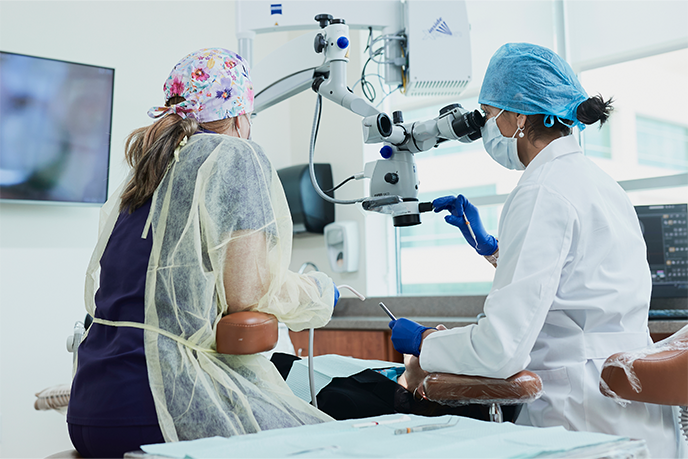 Dentist and assistant working on patient